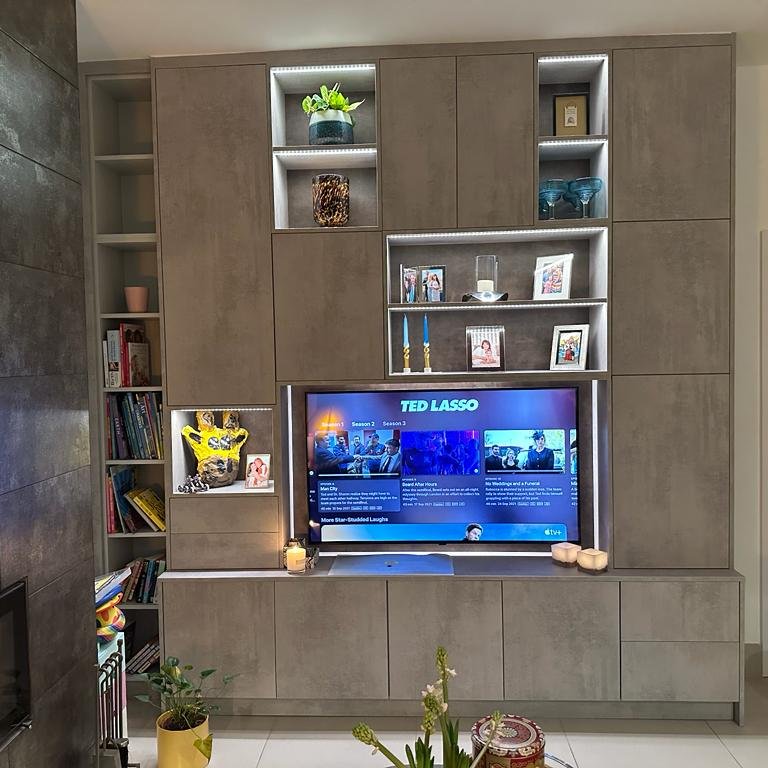 Modern media unit with shelves, lighting and concrete effect board in Teddington TW11