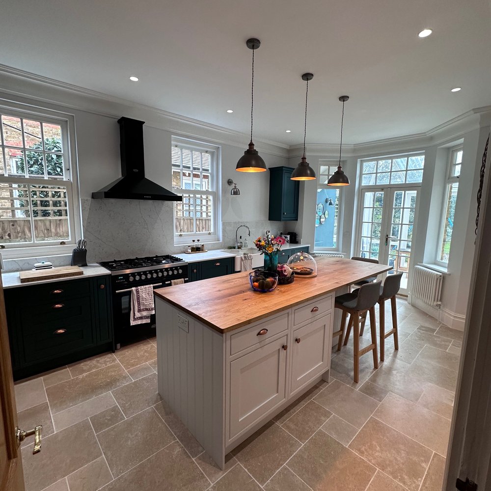 Fitted kitchen with breakfast bar island  in Weybridge KT12